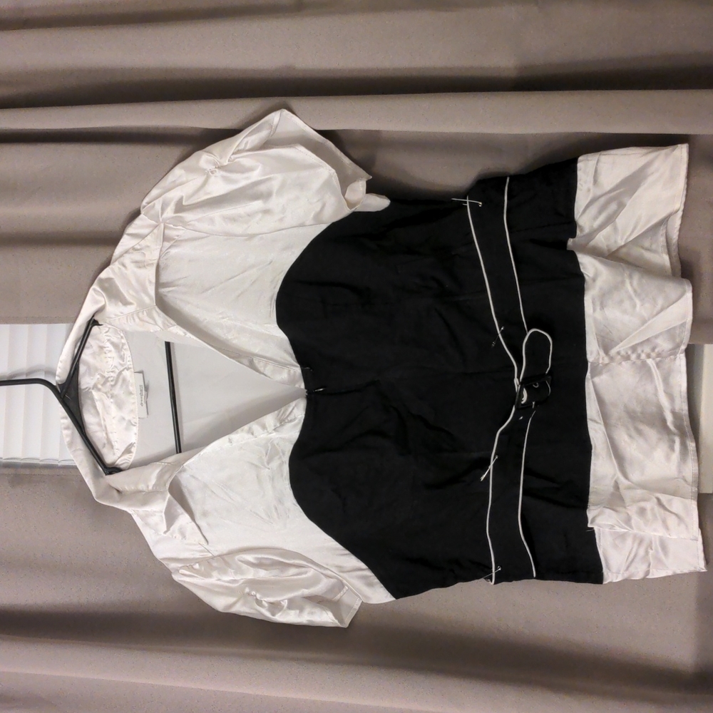 Black and white dressy blouse with bodice piece.
